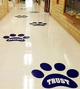 School floors are an impactful location to remind students of events, educate and promote good "life lessons".